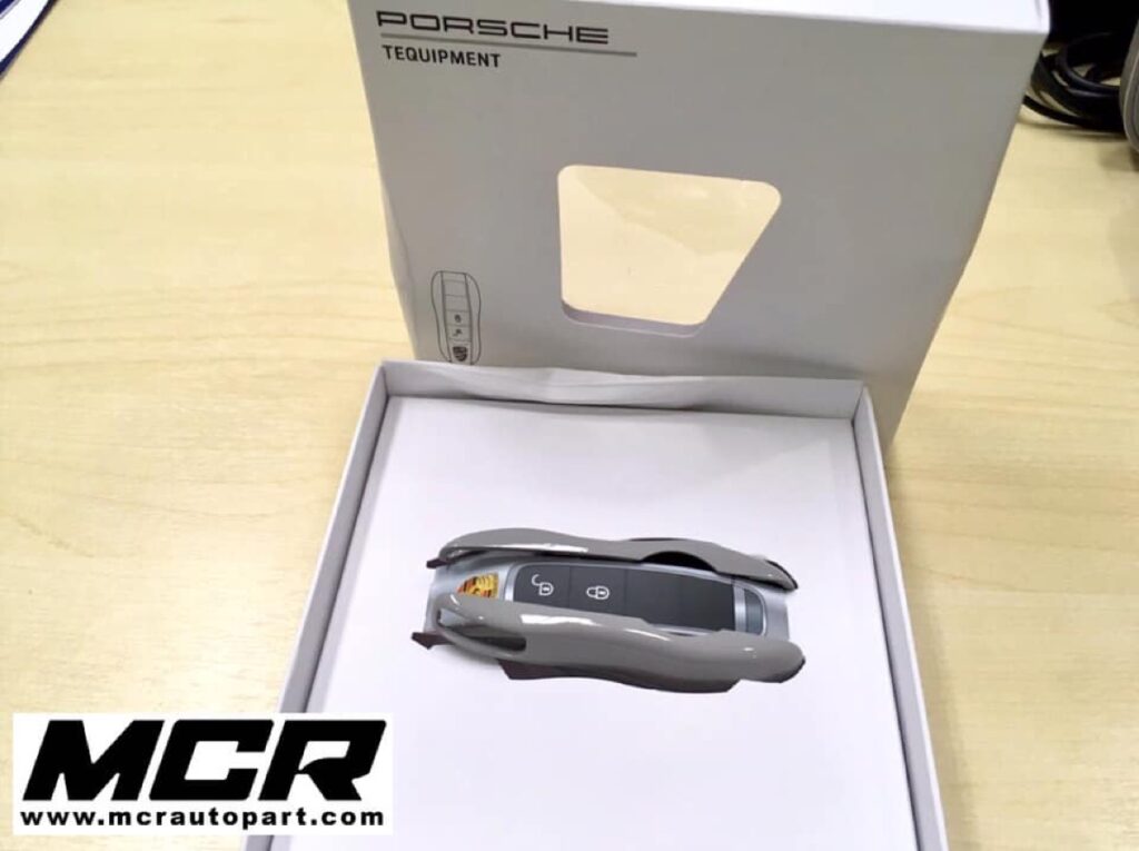 กรอบกุญแจ Porsche สีเทา อะไหล่แท้ จาก MCR Autoparts